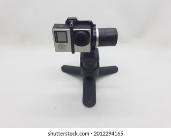 Modern Electronic Mobile Simple Small Portable Gimbal for Sport Action Camera Videography in White Isolated Background