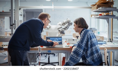 Modern Electronics Development Facility: Computer Design Student And Senior Engineer Work On Software For Robot Arm With Silicon Semiconductor. Modern Technology And Optimisation Concept.