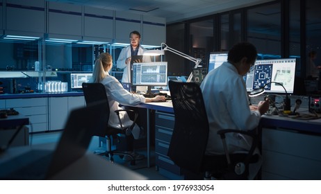 Modern Electronics Development Facility: Diverse Team of Multi-Ethnic Engineers, Scientists Work on Computers, Design Robotics PCB, New Generation Silicon Microchips, Manufacturing Semiconductors - Shutterstock ID 1976933054