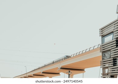 Modern elevated train on a bridge in urban cityscape with public transportation infrastructure