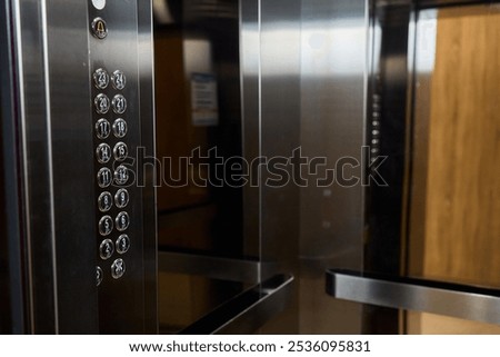 The modern elevator has a stylish control panel and elegant wood accents for function and beauty