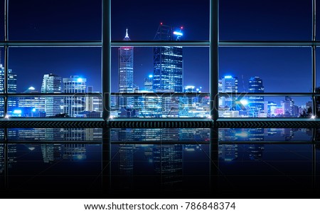 Modern empty and clean office interior with glass windows , Perth city skyline background , night scene .