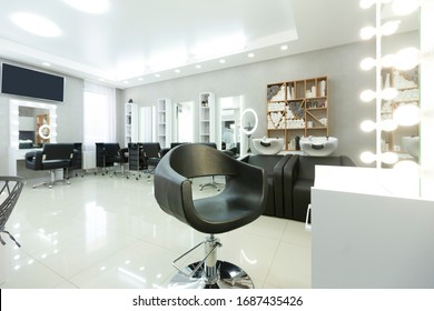 Modern empty hair saloon with chairs and mirrors, free space