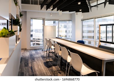 Modern Empty Office Room Kitchen Bar In Building With Corporate Business Table By Glass Window And Presentation Screen Projector Many Row Chairs Nobody