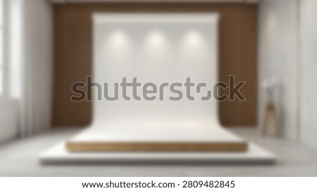 A modern, empty photography studio set up with a seamless white backdrop and professional lighting, ready for a photoshoot.