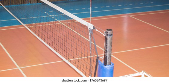 Modern empty school gym indoor with volleyball net