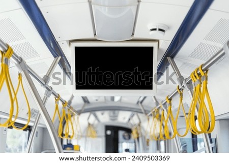 Modern empty tv screen inside bus, train, or tram. Advertising, notification in public transport concept. Showing information for passengers about number and line of route, destination, stops.