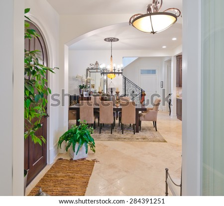 Modern Entrance Hall Lobby With The Stylish Wooden Door And Dining Room At Back Modern Entrance Hall Lobby With The Stylish Wooden Door And Dining Room At Back