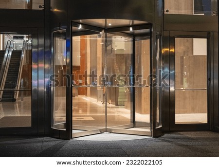Modern entrance with revolving door. Elegance. Revolving door in reception of office building