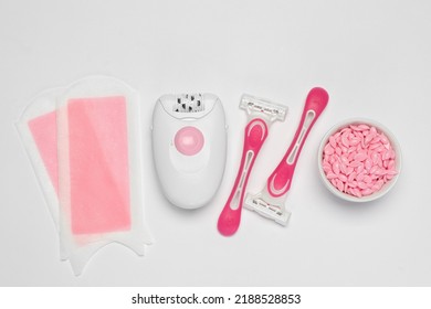 Modern Epilator And Other Hair Removal Products On White Background, Flat Lay