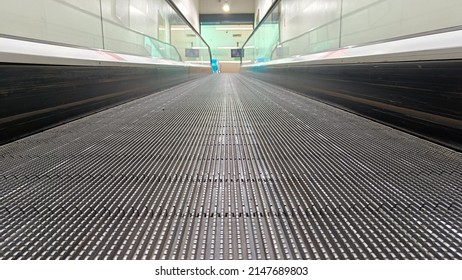 Modern escalator at metro station or supermarket