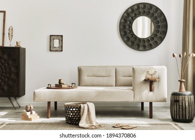 Modern ethnic living room interior with design chaise lounge, round mirror, furniture, carpet, decoration, stool and elegant personal accessories. Template. Stylish home decor.