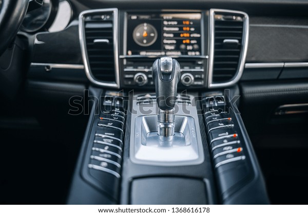 Modern\
expensive car interior and gearbox shift handle\
