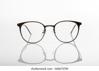 Modern Eye Glass On White Background Isolated Wuth Clear Shadow.