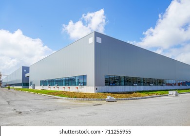 A modern factory building - Shutterstock ID 711255955