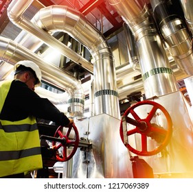 modern factory worker turning valve                    