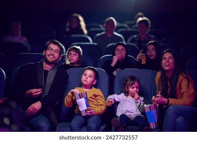 A modern family enjoys quality time together at the cinema, indulging in popcorn while watching a movie with their children - Powered by Shutterstock