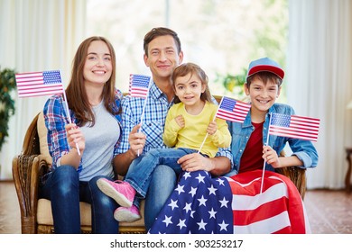 Modern family of patriots with USA flags