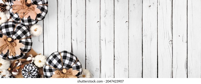 Modern Farmhouse Fall Corner Border Over A White Wood Banner Background. Black And White Buffalo Plaid Pumpkins And Rustic Decor. Above View With Copy Space.