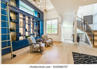 Modern Farmhouse Style Living And Family Room With Large Windows Cabinets In Blues And Greens