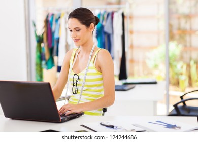 Modern Fashion Designer Sketching Using Laptop Computer