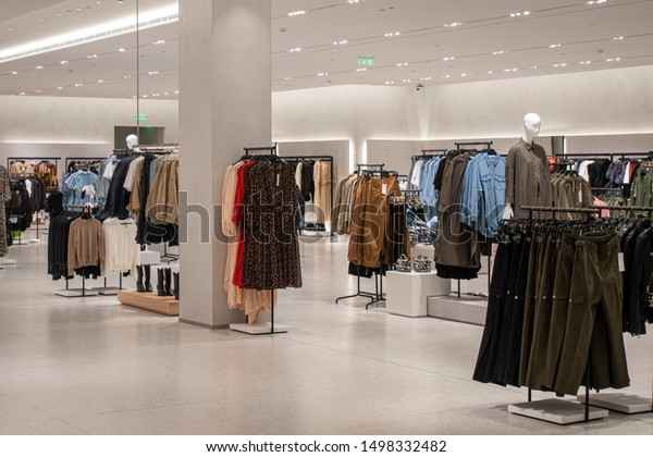 Modern fashionable brand interior of clothing\
store inside shopping\
center