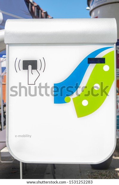 Modern fast charging station for electric\
vehicles in the city within a parking\
lot