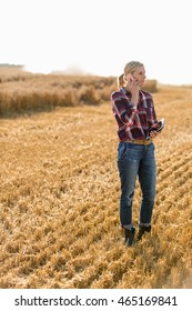 Modern Female Farmer With Tablet On Her Wheat Field