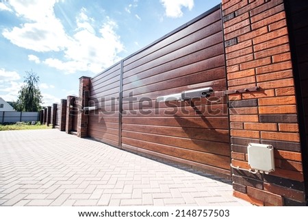 modern fence with automatic gate