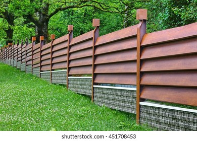 Modern Fence Made From Metal Siding And  Profile Sheet Like As Natural Wood Board