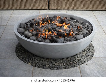 modern fire pit on backyard patio                              