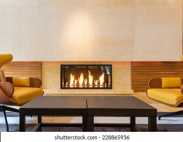 Modern Fireplace Sitting Area With Two Leather Chairs. Interior Design.