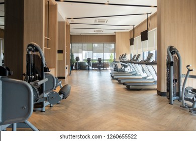 Modern Fitness Center With Gym Equipment Decoration. Interior Design Background