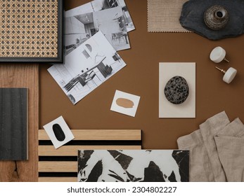 Modern flat lay composition in brown and beige color palette with textile and paint samples, lamella panels and tiles. Architect and interior designer moodboard. Top view. Copy space.
