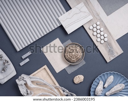 Modern flat lay composition with cement tiles, panels, facing, stones. Stylish interior designer moodboard. Blue, blue and gray color palette. Copy space. Template.