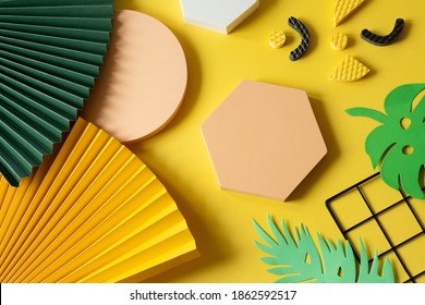 Modern Flat Lay Composition Of Geometric Shapes, Paper, Fan, Black Grid On A Yellow Background Memphis Milano Style