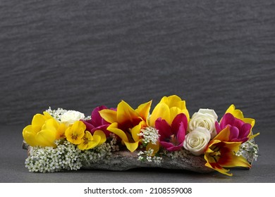 Modern Floral Arrangement Against A Dark Background