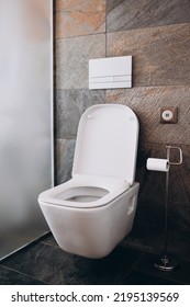Modern flush white toilet or WC in small bathroom with push button flush and USB charging - Shutterstock ID 2195139569