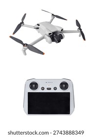 Modern foldable drone with camera and remote controller isolated on white background.