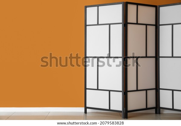 Modern folding screen near\
color wall