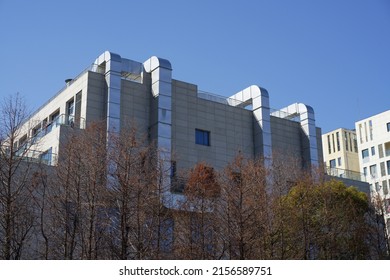 A Modern Food Factory With Chimney And Tree