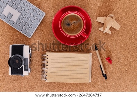 Modern freelancer setup for remote work and exploration. Office flatlay with travel concept.