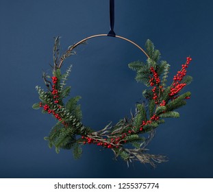 Modern Fresh Greens Christmas Wreath On Blue Background