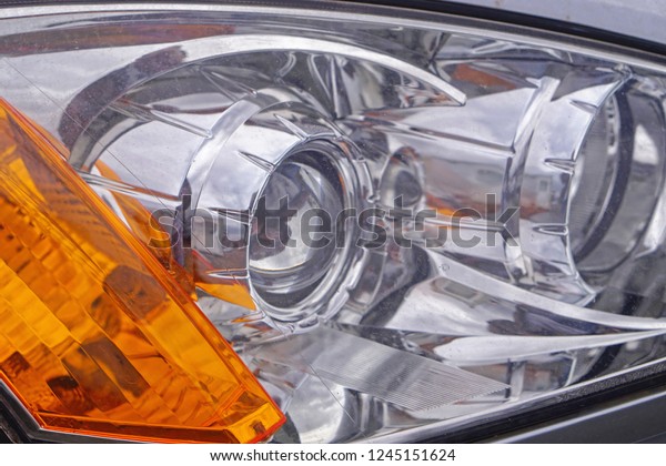 Modern front\
headlights with lens projectors\
glass