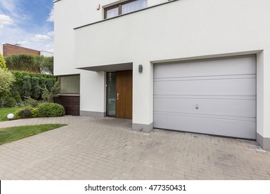 Modern Front House Entrance With One Car Garage