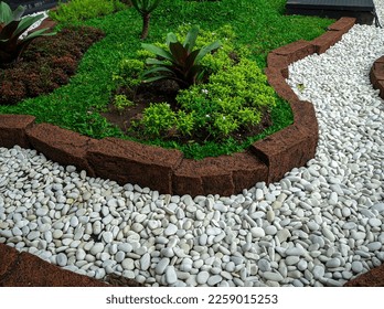 Modern front yard with beautiful garden and white stone garden - Shutterstock ID 2259015253