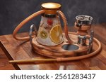 A modern fruit-flavored hookah with wood and gold accents, offering a luxurious and enjoyable smoking experience with stylish design details for a premium feel.