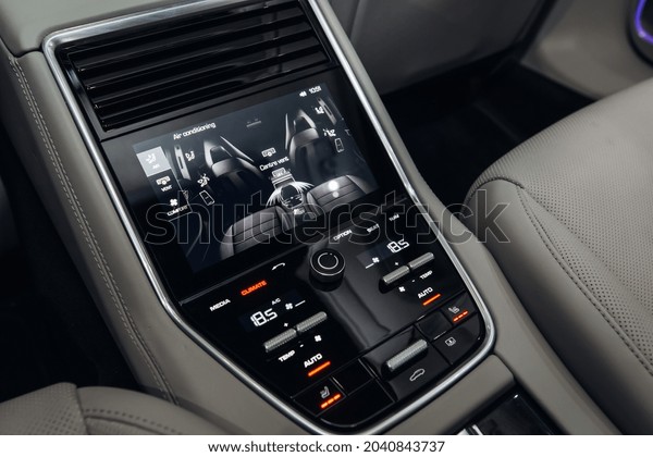 Modern and futuristic car rear seats row air\
conditioning control system with touchscreen. Monitor with car\
interior adjustment 