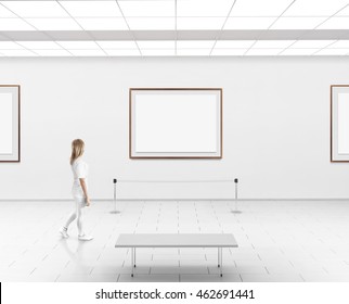 Modern Gallery Wall Mockup. Woman Walk In Museum Hall With Blank Wall With Frames. White Clear Stand Mock Up Show. Display Artwork Presentation. Art Design Empty Floor. Expo Studio Wall In Center.