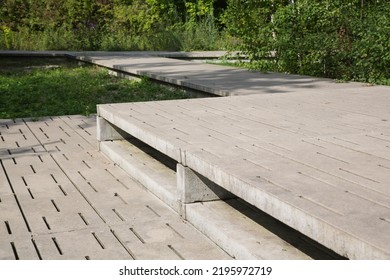 Modern Garden Design And Landscaping: Pedestrian Overpass Or Walkway With A Platform Both Made Of Concrete Paving Slabs With Gaps-environmentally Sustainable, Nature And Species Protection For Biotope